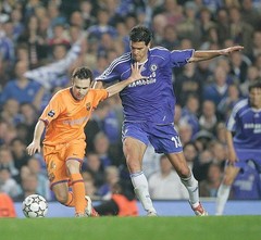Michael Ballack of Chelsea tussles with Andres Iniesta of Barclona- Old Photo