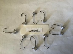 25 Hand made 1/8oz w/ keeper freestyle jig heads with a 1/0 bronze sickle hooks