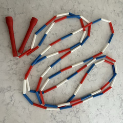 Vintage Red/White/Blue segmented skip/jump rope. Approx. 15 feet.