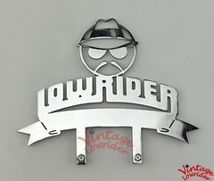 STAINLESS STEEL CUSTOM PLAQUE, LOWRIDER LETTER/HEAD DESIGN, SHOW PART ACCESSORY.