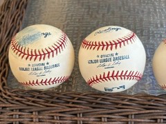 MAJOR LEAGUE BASEBALLS (4) WITH COMMISSIONER SELIG IN VARIOUS CONDITION.