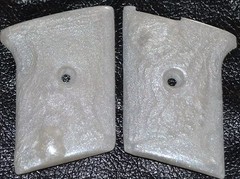 Phoenix Arms Raven 25 ACP pistol grips pearl white smooth slide safety plastic