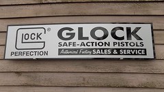 MODERN STYLE GLOCK PISTOL/FIREARMS DEALER SIGN/AD 1’X46″ ALUM. PANEL W/LOGO